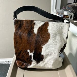 Cow hide and leather tote.
